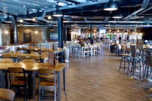 a restaurant with tables and chairs in a room at The Luxury break Sleeps 6 at Kingfisher Court South facing in Tattershall