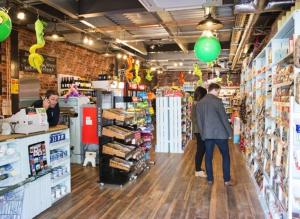 a group of people standing in a store aisle at The Luxury break Sleeps 6 at Kingfisher Court South facing in Tattershall