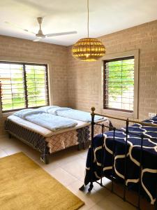 Cama ou camas em um quarto em Ama Batokunku Resort