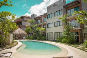 Bazén v ubytování Luxury Condos Macondo Tulum nebo v jeho okolí