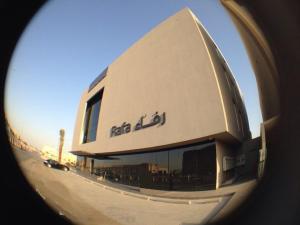 a view of a building from an airplane window at Rafa Hotel Apart in Riyadh