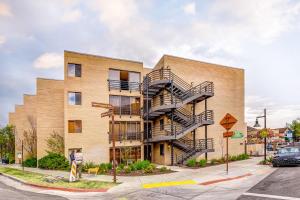 a brick building with a spiral fire escape at New Claim Traveler in Park City