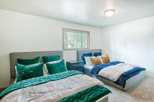 a bedroom with two beds and a window at The Hillside Retreat in South Lake Tahoe