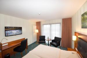 TV a/nebo společenská místnost v ubytování Hotel Freihof