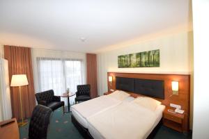 Postel nebo postele na pokoji v ubytování Hotel Freihof