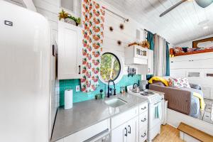 a kitchen in a tiny house with a sink at Chimney Rock Tiny Home in Canyon Lake