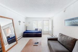 a living room with a couch and a bed at Wildernest Getaway in Silverthorne