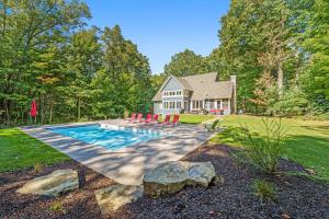 a house with a swimming pool in the yard at Thunder Road in Fennville