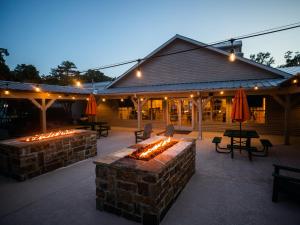 a patio with a fire pit in front of a building at Holiday Inn Club Vacations Villages Resort at Lake Palestine in Flint