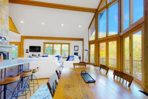 a living room with a table and a couch at Tuckerman Tollhouse in Jackson