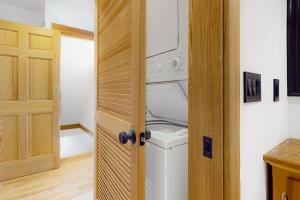 a washer and dryer in a room with a door at Tuckerman Tollhouse in Jackson +52 photos