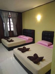 Llit o llits en una habitació de Samudra Beach Chalet