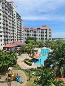 a view of the pool at a resort at Glory Beach Resort Seaview Private 2BR in Port Dickson