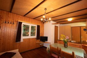 a dining room with a table and a window at Residenz Edelweiss SAAS310 in Saas-Balen