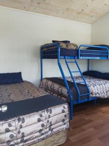 a room with two bunk beds and a mattress at Charleston Holiday Park in Charleston