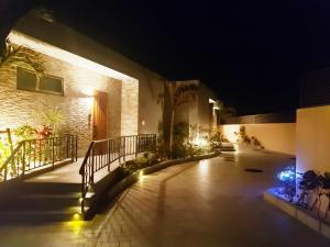 a courtyard at night with lights on a building at -Villa Rikyu- 離宮 in Miyako Island +15 photos