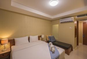 
Кровать или кровати в номере Mac Resort Hotel

