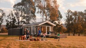 a group of people in front of a tiny house at Wallinga Farmstay Mudgee in Mudgee