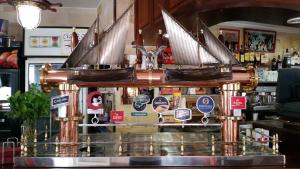 a pirate ship on top of a bar at Apartamentos Vista al Puerto in San Antonio Bay