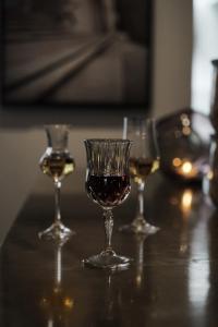 a group of three wine glasses sitting on a table at Hotel SP34 by Brøchner Hotels in Copenhagen