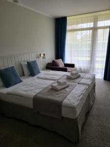 Postel nebo postele na pokoji v ubytování Marine Hotel Jūrmala