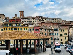 a group of buildings in a city with a bus at Duprè Apartment in Siena