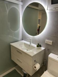 a bathroom with a sink and a mirror at ocean experience / EXPERIENCE HOLIDAYS TENERIFE in Callao Salvaje