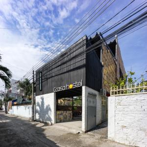 a store with a black and white building at Ccasa Hostel in Nha Trang