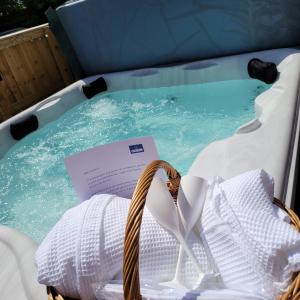 a basket of towels and a paper in a swimming pool at The Blue Bell Inn in Weaverthorpe