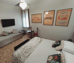 Postel nebo postele na pokoji v ubytování B&B Cà del Poeta