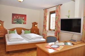 Säng eller sängar i ett rum på Landhotel Zur Pferdetränke