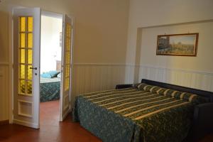 Postel nebo postele na pokoji v ubytování Pantheon Inn