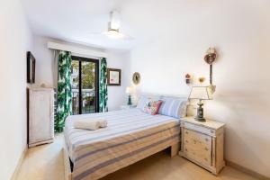 a bedroom with a bed and a window at Ca Na Bel in Port de Soller