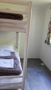 Postel nebo postele na pokoji v ubytování Mobil home climatisé Carnac