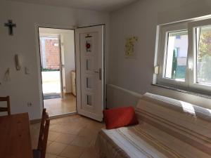 Postel nebo postele na pokoji v ubytování Minihaus in Zagreb