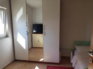 TV a/nebo společenská místnost v ubytování Minihaus in Zagreb
