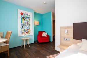 Postel nebo postele na pokoji v ubytování Hotel Am Froschbächel