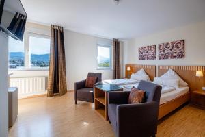 Postel nebo postele na pokoji v ubytování Hotel Am Froschbächel