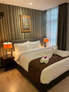 Giường trong phòng chung tại Geo Boutique Hotel - Seri Kembangan