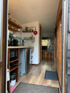 a kitchen with wooden floors and a counter top at Trees House Parang in Petroşani