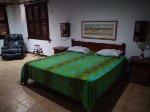 A bed or beds in a room at Casa de Praia Pecém