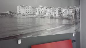 a black and white photo of a river with buildings at Alma Hotel in Palermo