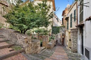 an alley in an old town with stone buildings at Casa via Montà in centro in Sanremo