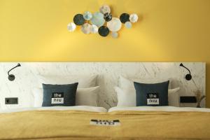 سرير أو أسرّة في غرفة في Holiday Inn - the niu, Kettle Stuttgart Vaihingen by IHG