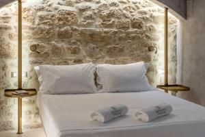 Posteľ alebo postele v izbe v ubytovaní Inotropes Boutique Suites - Adults Only