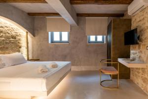 Posteľ alebo postele v izbe v ubytovaní Inotropes Boutique Suites - Adults Only