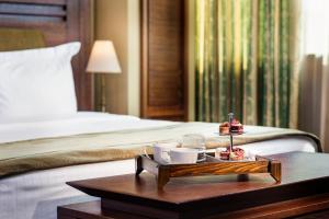 A bed or beds in a room at Grand Hotel Sofia