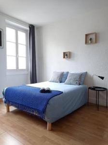Posteľ alebo postele v izbe v ubytovaní Appartement cosy au coeur de la ville d'Auch