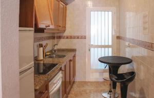 A kitchen or kitchenette at Amazing Apartment In Orihuela Costa
