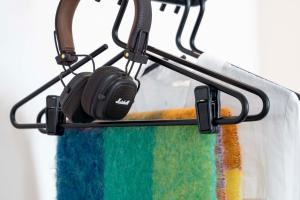 a pair of headphones hanging from a towel rack at Le 12 Hôtel in Paris